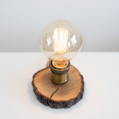 edison-lamp-on-bedside-table-near-sofa-in-studio-r-2024-12-13-00-57-04-utc